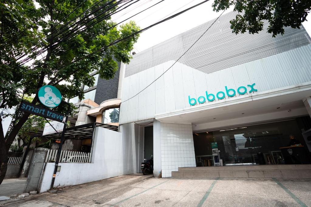 a building with a sign on the side of it at Bobopod Paskal, Bandung in Bandung