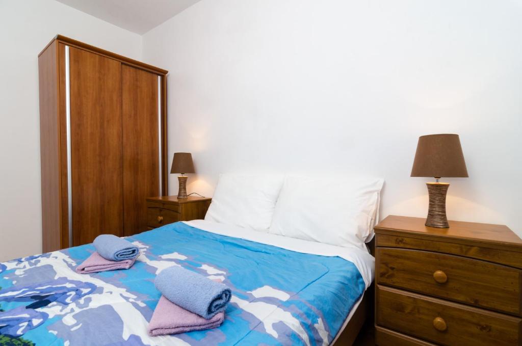 Postel nebo postele na pokoji v ubytování Apartment Amela