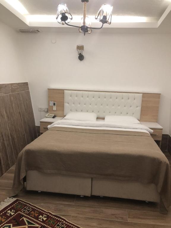 Postel nebo postele na pokoji v ubytování Ziyagil Konağı