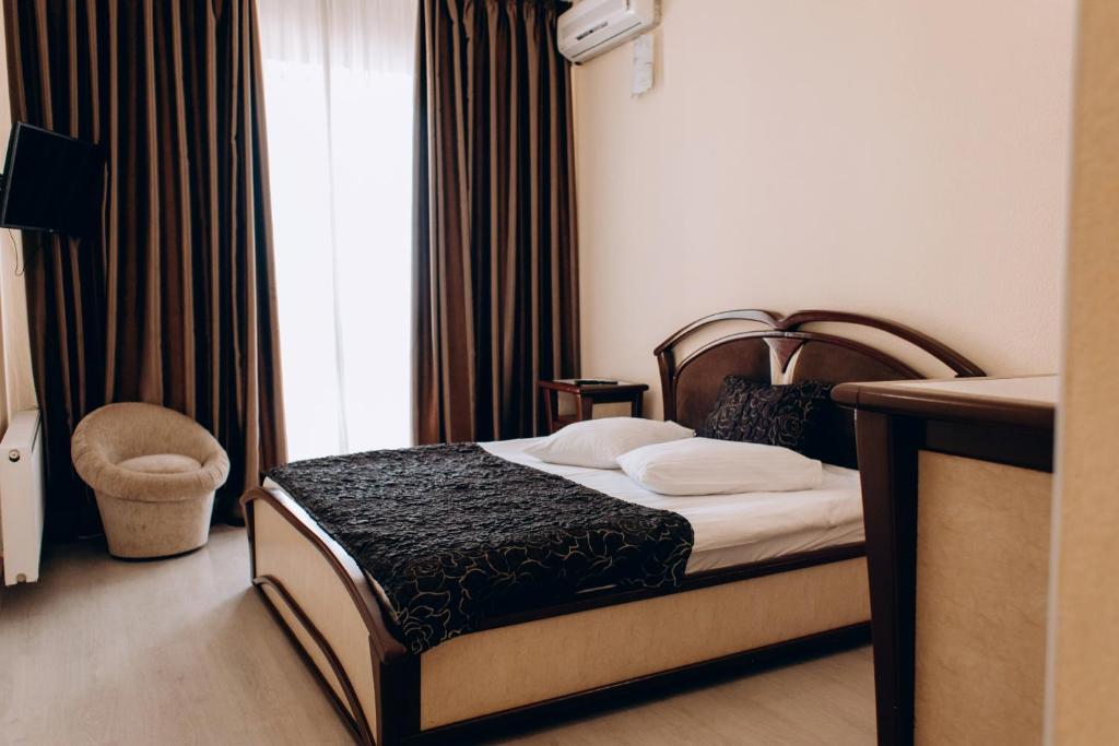 Postel nebo postele na pokoji v ubytování Hotel DA NONNA