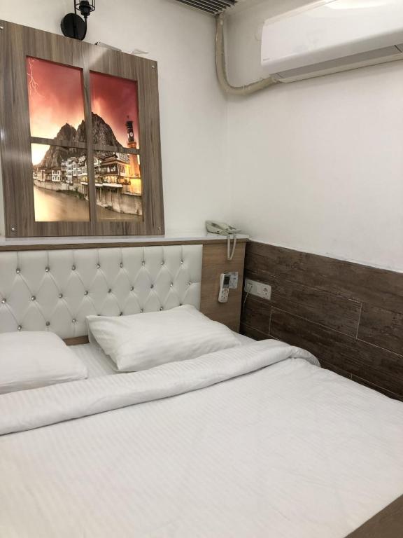 Postel nebo postele na pokoji v ubytování Ziyagil Konağı