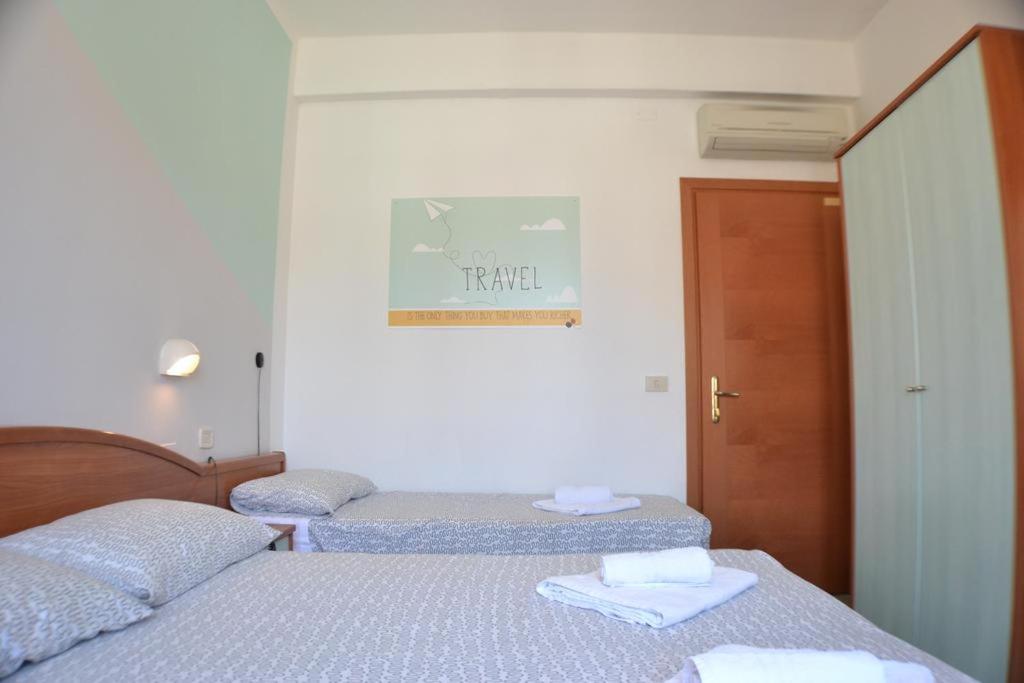 Łóżko lub łóżka w pokoju w obiekcie Hotel Villa Caterina