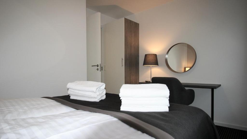 Postel nebo postele na pokoji v ubytování Hotel Aarhus City Apartments