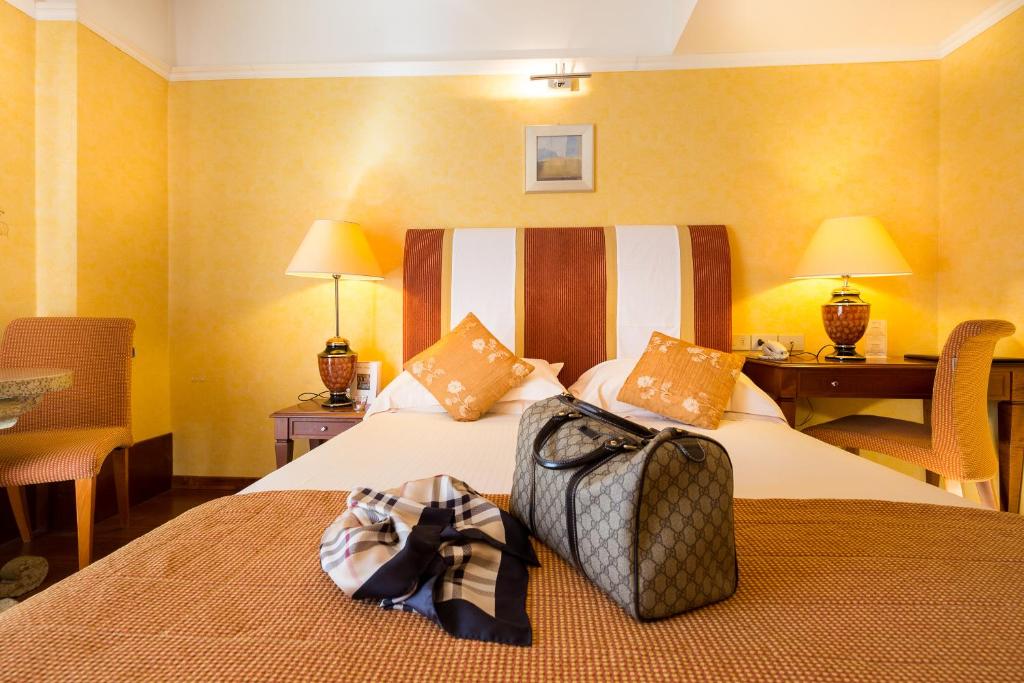 A bed or beds in a room at Bio Boutique Hotel XU' - Gruppo Ambienthotels