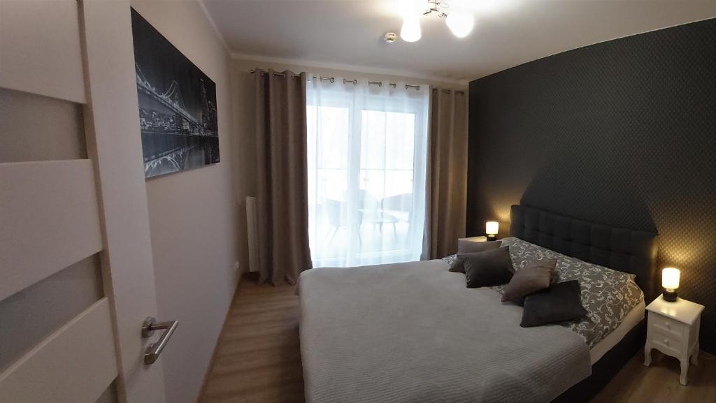 Posteľ alebo postele v izbe v ubytovaní Polanki Park Apartament LEON
