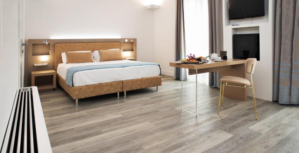 Postel nebo postele na pokoji v ubytování Hotel Italia