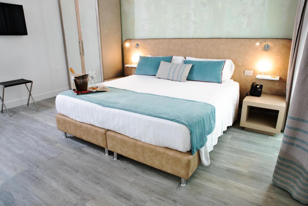 Postel nebo postele na pokoji v ubytování Hotel Italia