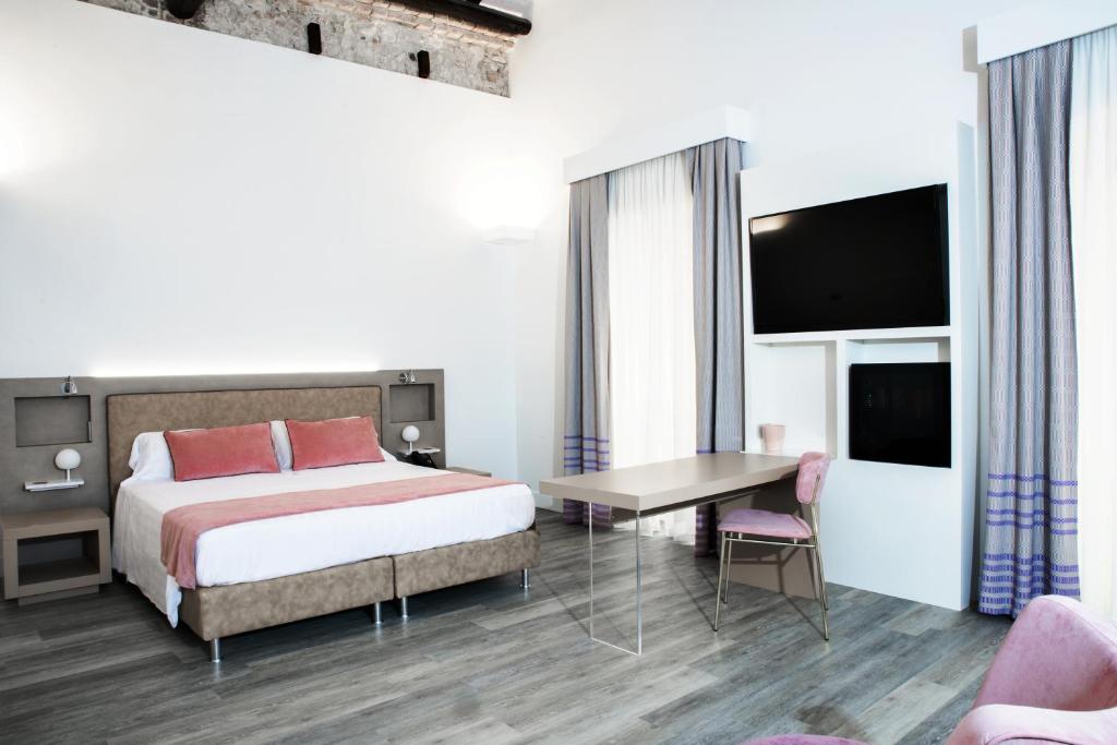 Postel nebo postele na pokoji v ubytování Hotel Italia