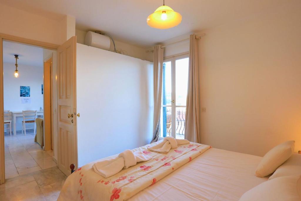 Postel nebo postele na pokoji v ubytování Sterna Apartment