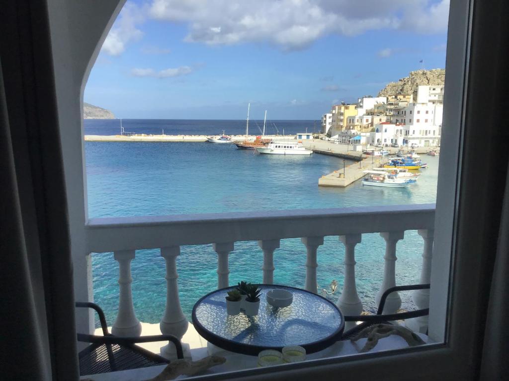 a view of the ocean from a balcony at Mimis & Connie 1 in Karpathos Town