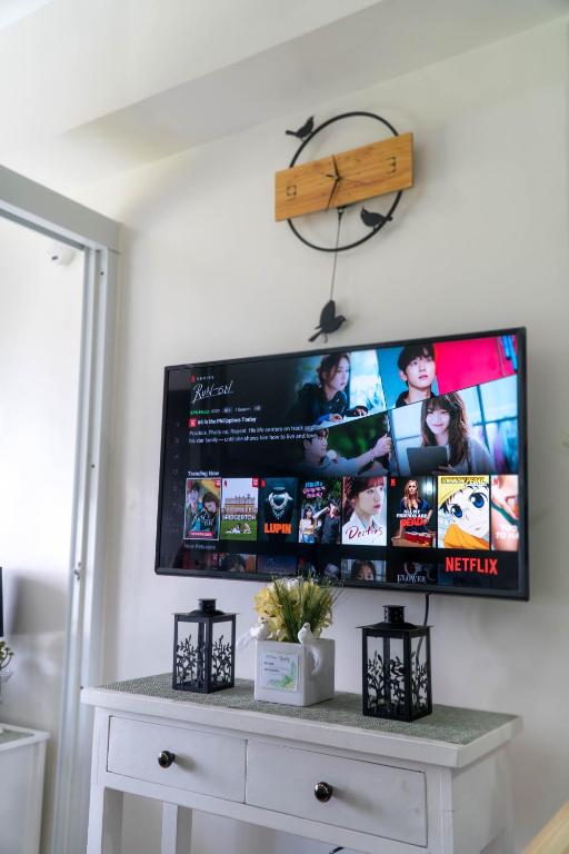 a flat screen tv hanging on a wall at An Oasis in Tagaytay in Tagaytay