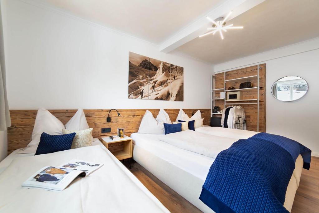 Postel nebo postele na pokoji v ubytování Boutique Hotel ANYBODY