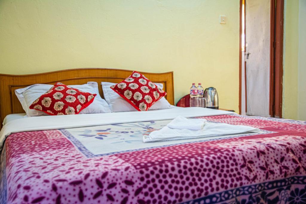 A bed or beds in a room at Hotel Plaza Nepal