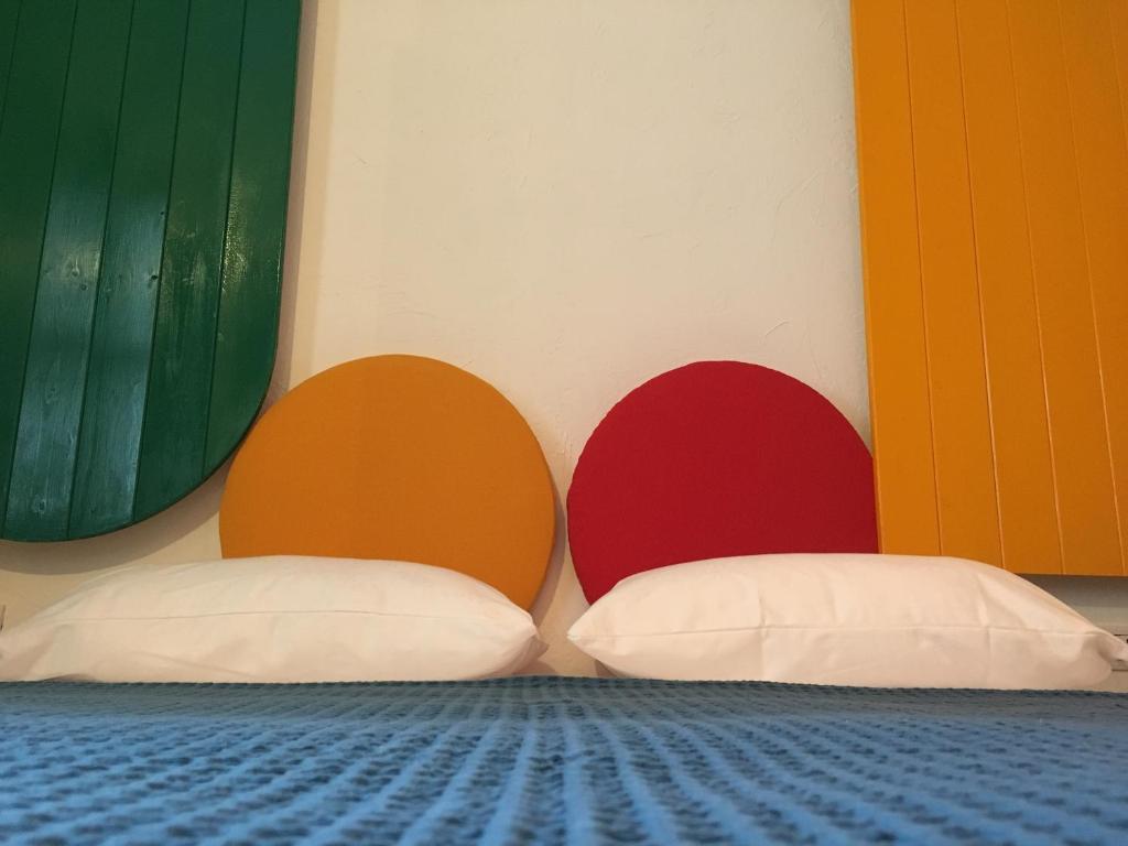 A bed or beds in a room at Hotel Pelaghea