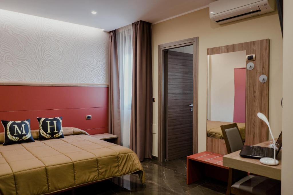 A bed or beds in a room at Miryam House Affittacamere Suite e Relax