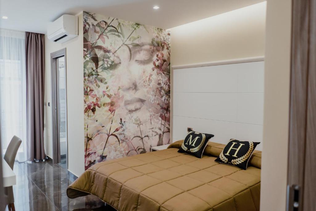 A bed or beds in a room at Miryam House Affittacamere Suite e Relax