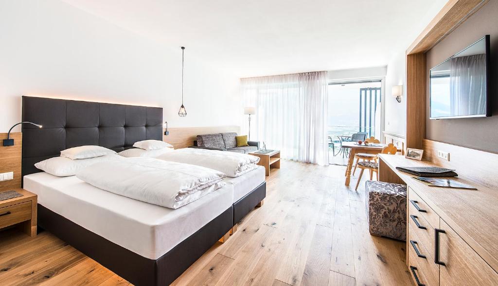 Postel nebo postele na pokoji v ubytování Hotel Törggelehof