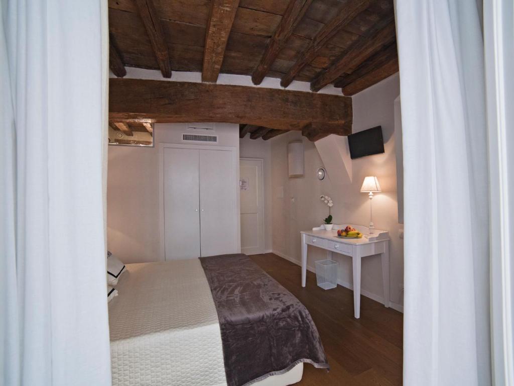 Postelja oz. postelje v sobi nastanitve B&B Il Corso