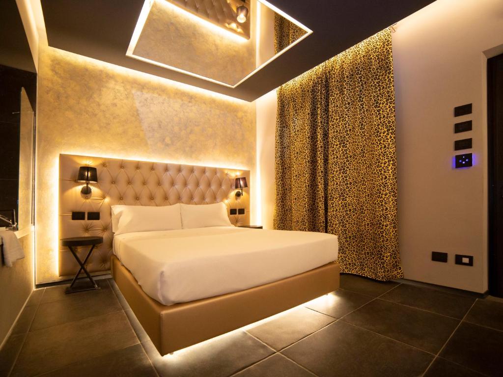 Postel nebo postele na pokoji v ubytování Motel Hotel Charlie