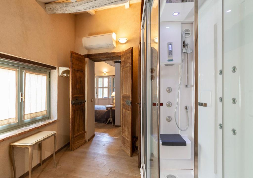 A bed or beds in a room at Cascina del Tempo Sospeso