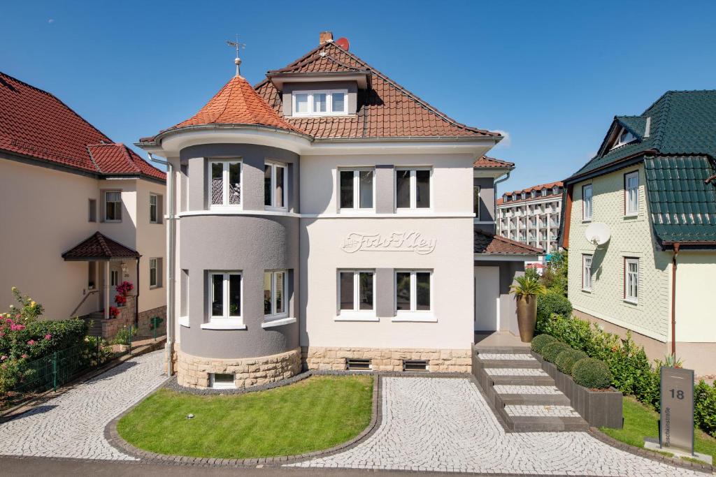 a large white house with a red roof at Villa P18 in Bad Liebenstein