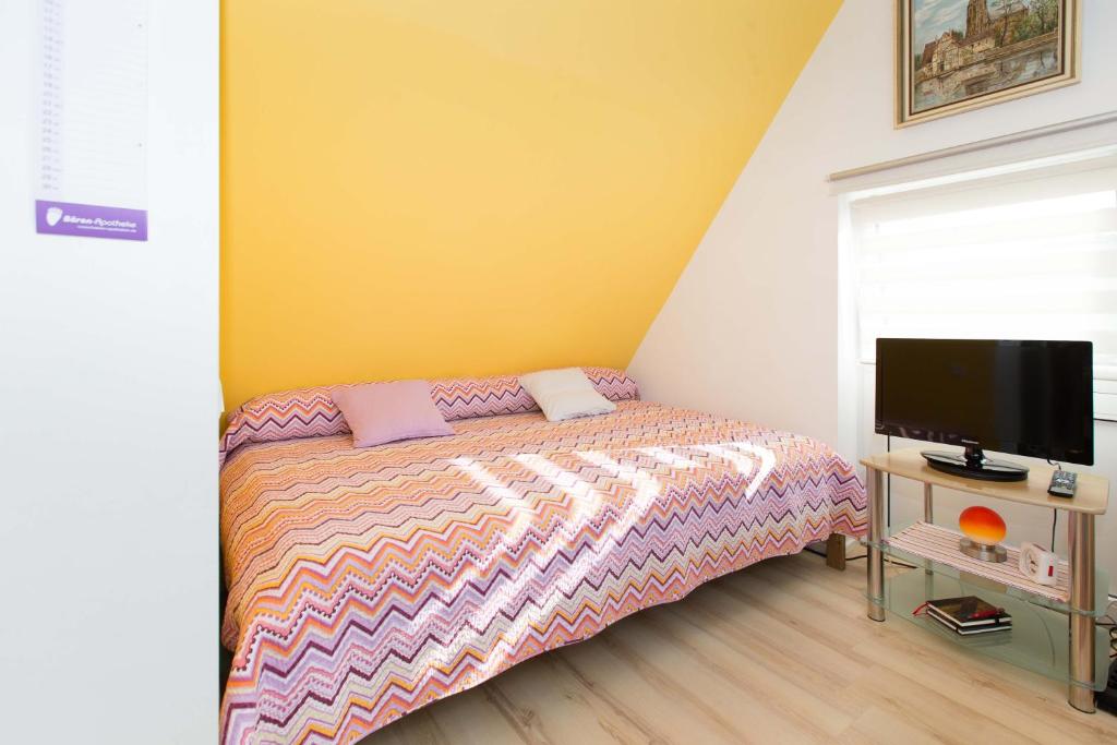 TV a/nebo společenská místnost v ubytování Casa Felicitas - Ferienwohnung & Studio