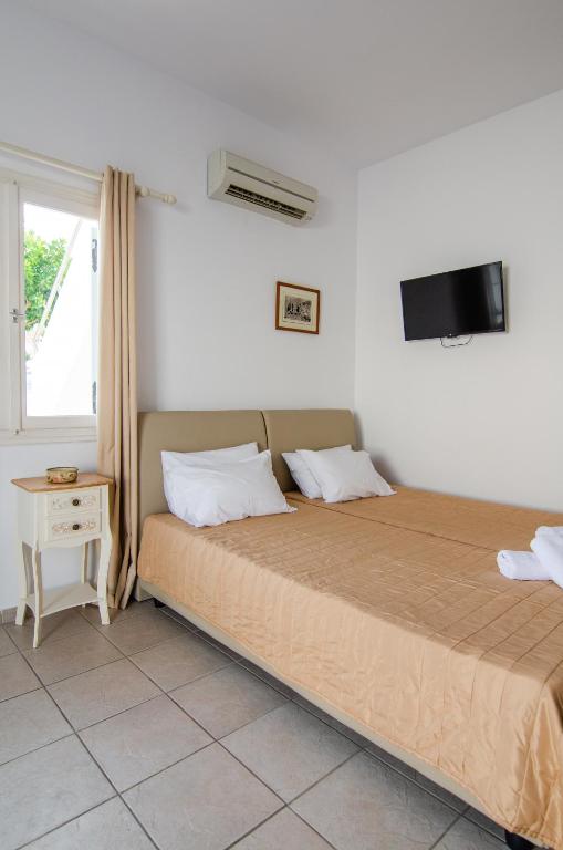 Voodi või voodid majutusasutuse Marias Rooms toas