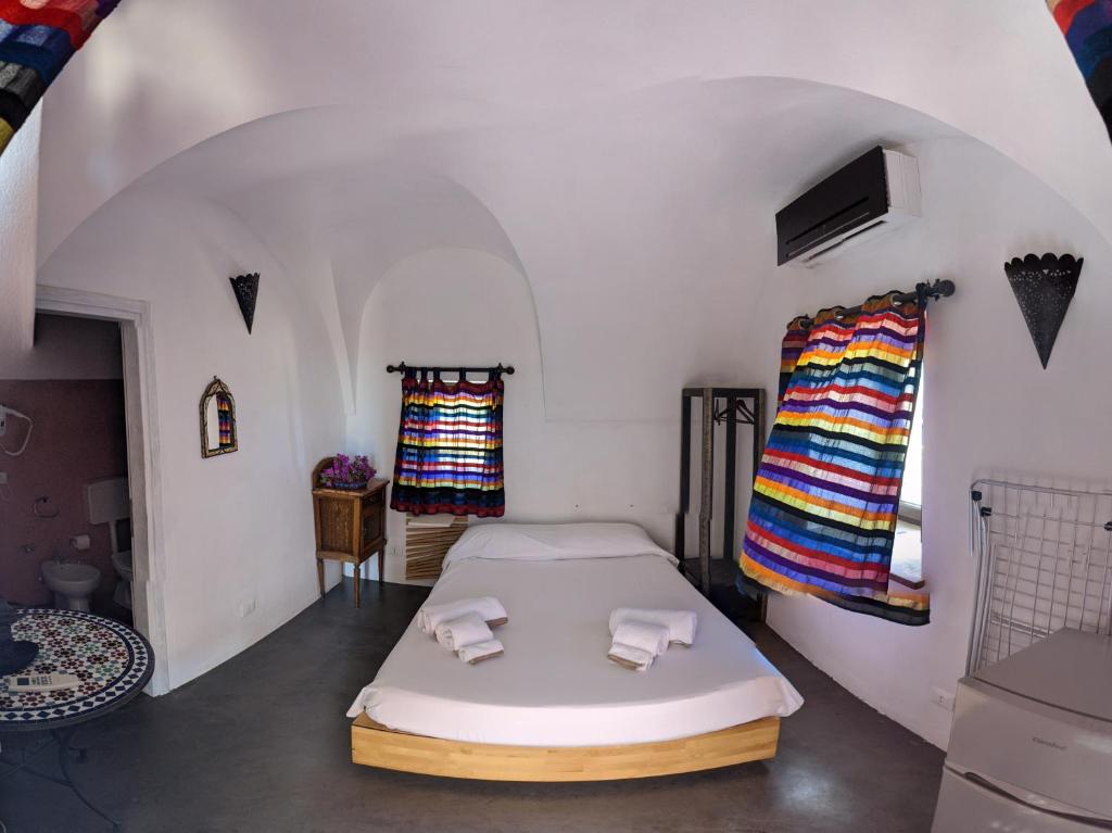 Łóżko lub łóżka w pokoju w obiekcie Horizon Pantelleria