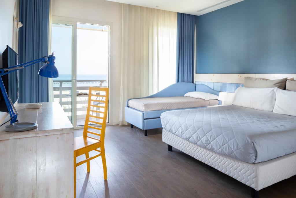 Postel nebo postele na pokoji v ubytování Hotel LaMorosa