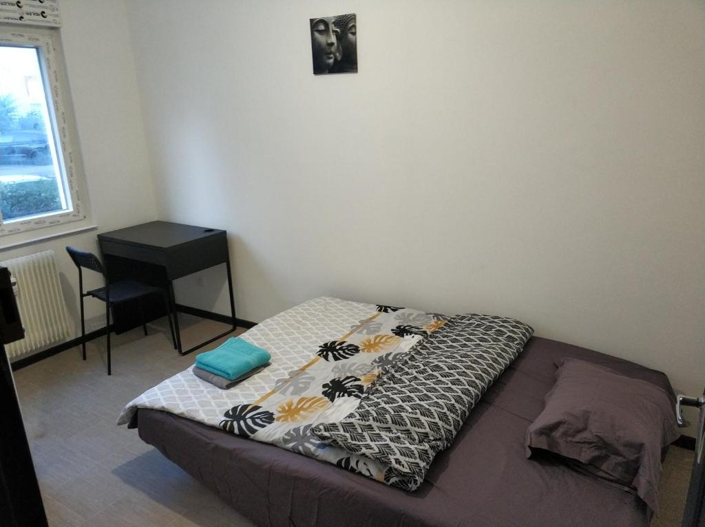 Postelja oz. postelje v sobi nastanitve Calme, chambre privée équipée Nr 1-4