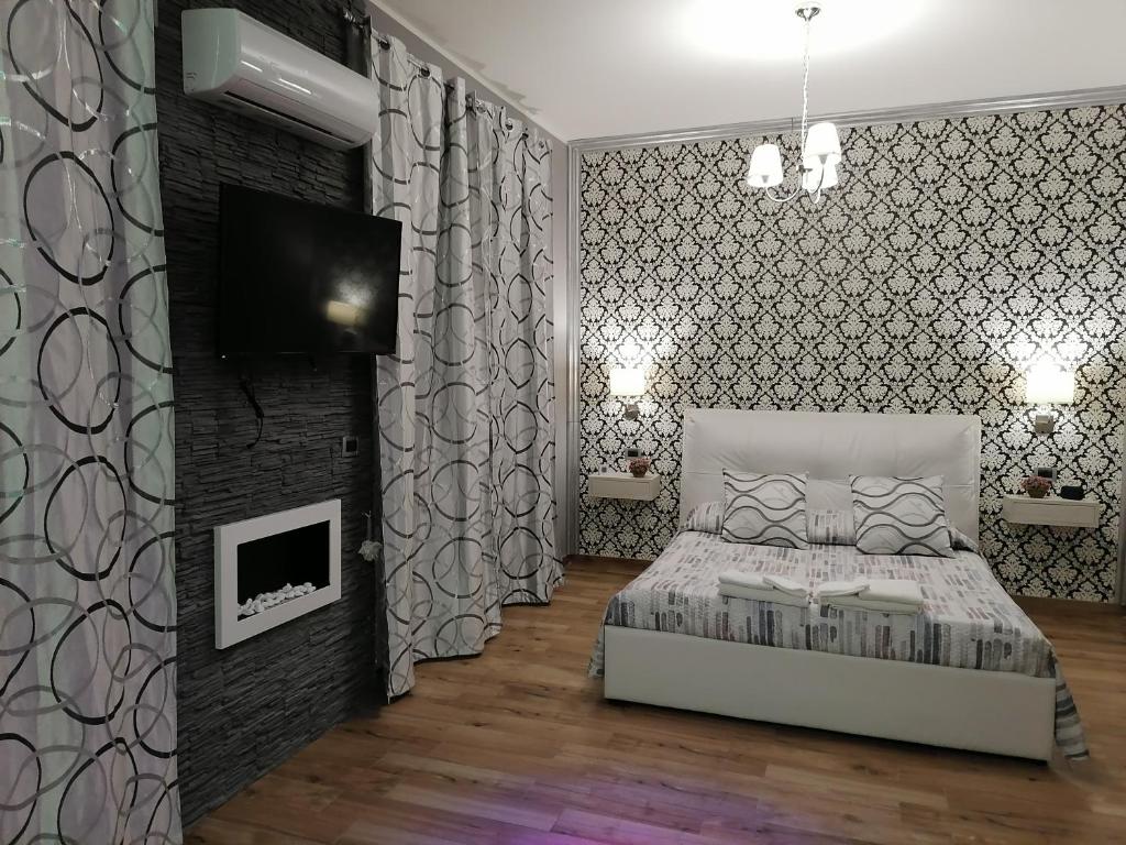 Postel nebo postele na pokoji v ubytování Home Syrakos B&B