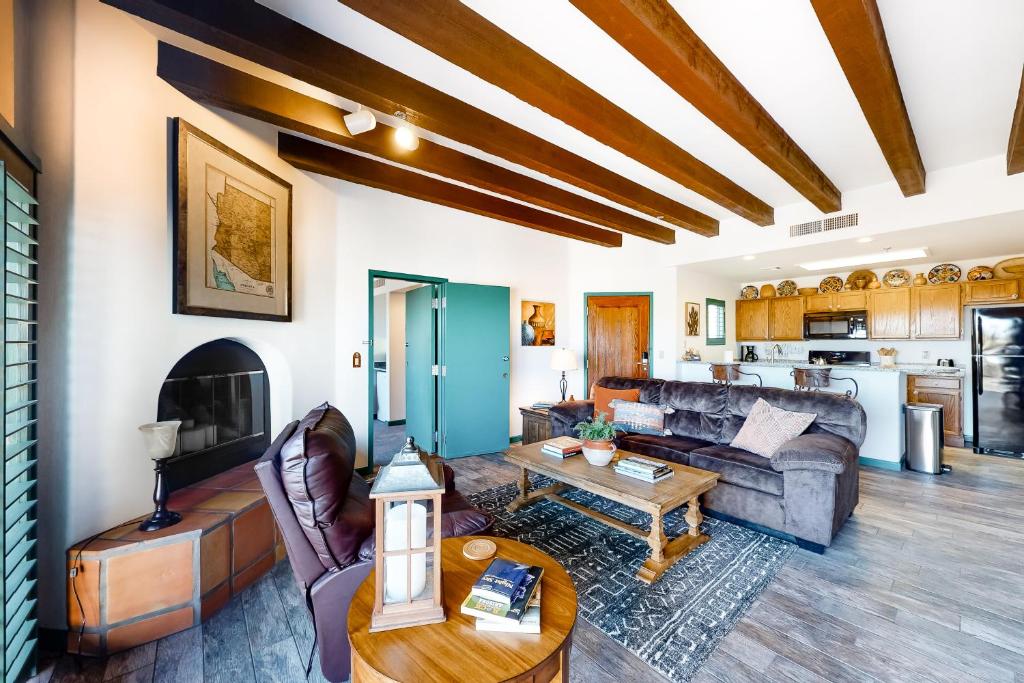 a living room with a couch and a table at Starr Pass Golf Casita in Tucson