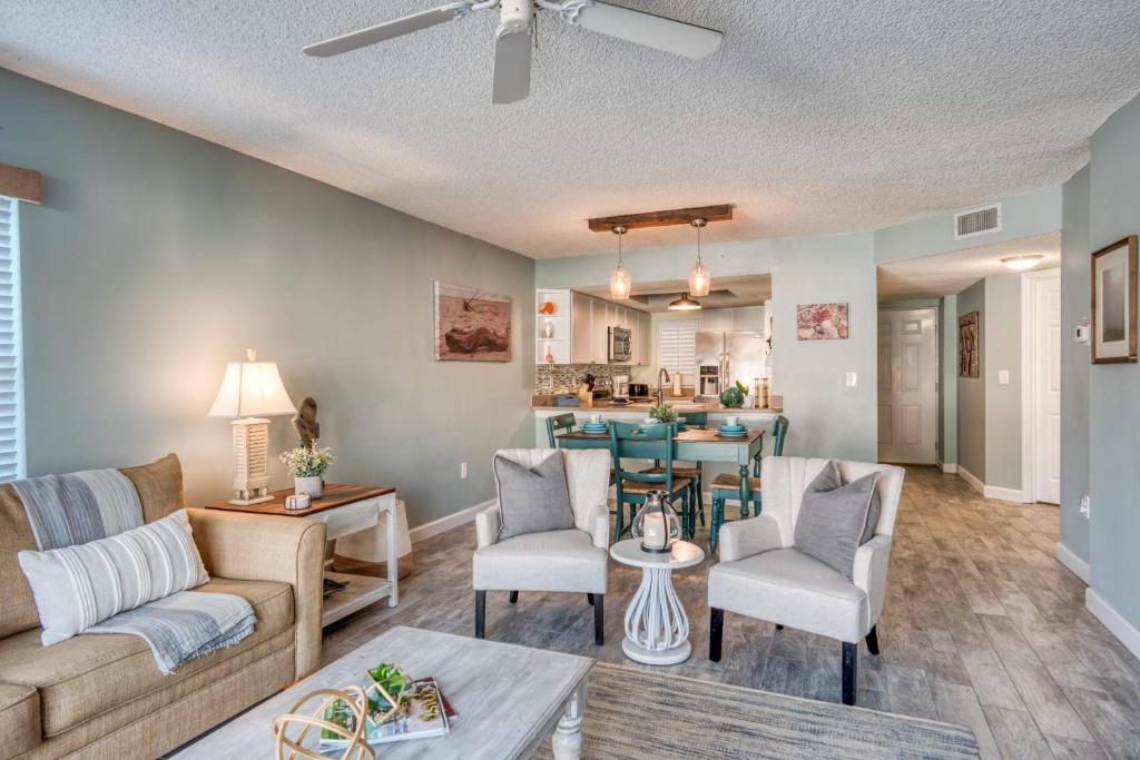 a living room with a couch and a table at Driftwood Escape in Saint Augustine Beach