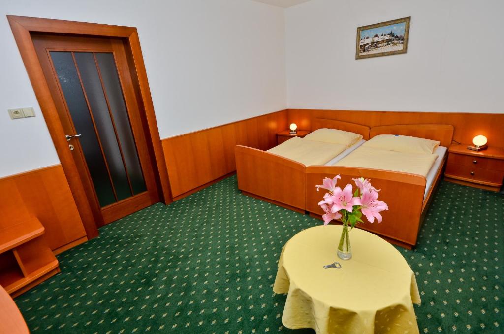 Postel nebo postele na pokoji v ubytování Hotel Kotyza
