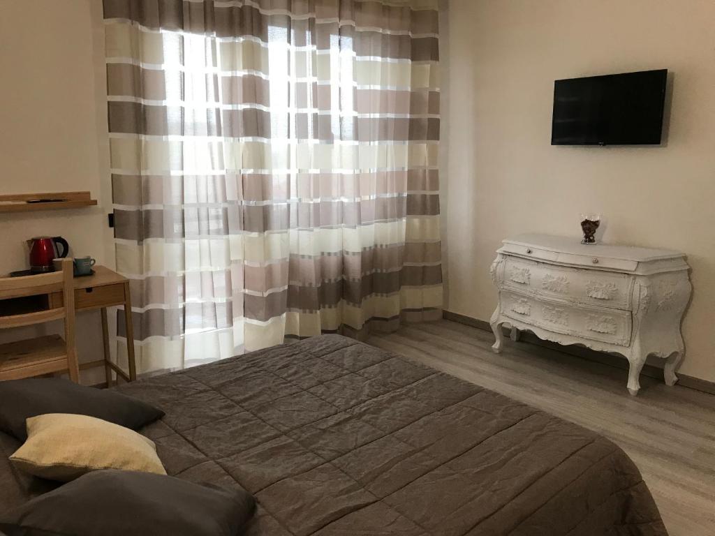 Posteľ alebo postele v izbe v ubytovaní ATTICO LIVORNO Bed & Relax