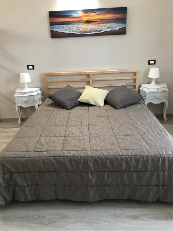 Posteľ alebo postele v izbe v ubytovaní ATTICO LIVORNO Bed & Relax