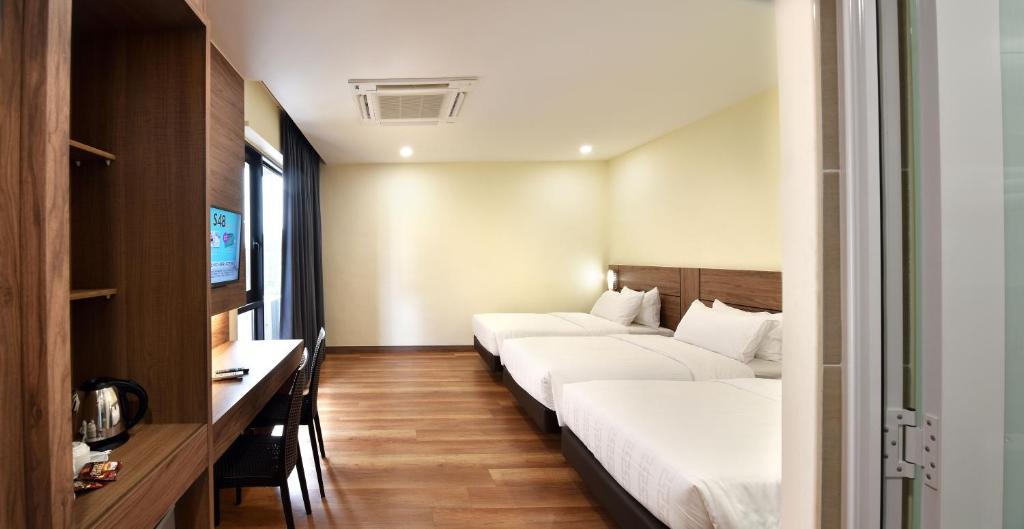 Postel nebo postele na pokoji v ubytování YANGTZE HOTEL 长江酒店