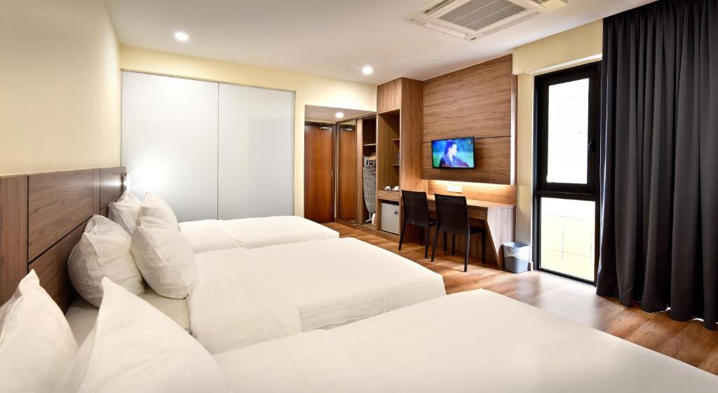 Postel nebo postele na pokoji v ubytování YANGTZE HOTEL 长江酒店