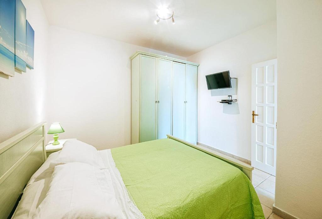 A bed or beds in a room at Appartamenti Ischia Casa Don Peppe