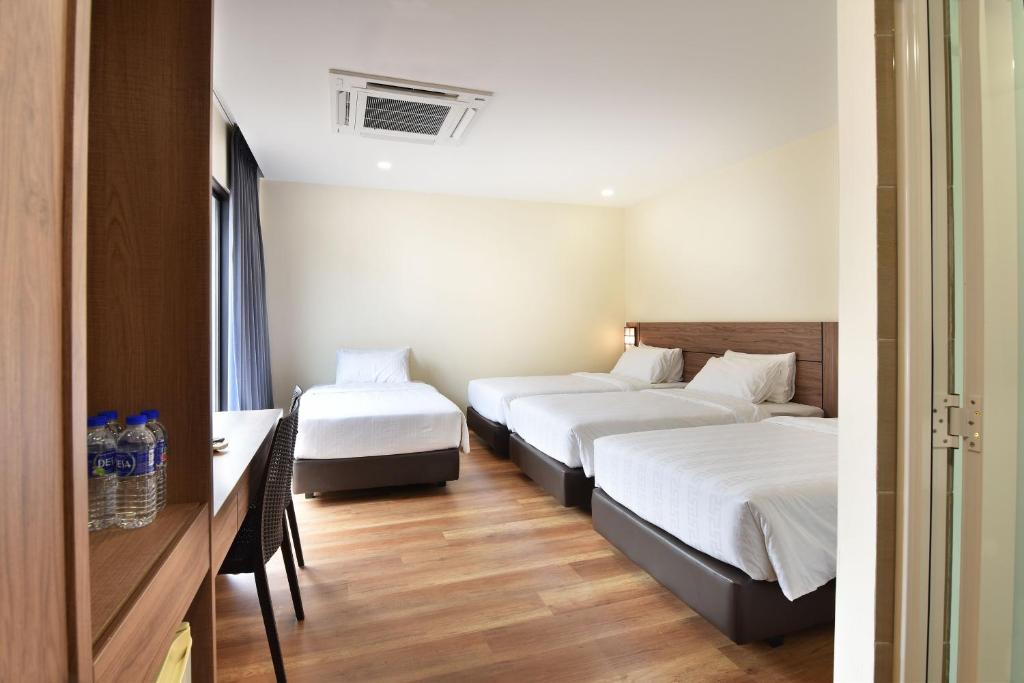 Postel nebo postele na pokoji v ubytování YANGTZE HOTEL 长江酒店