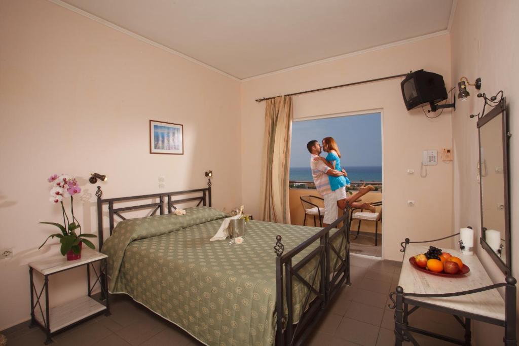 Postel nebo postele na pokoji v ubytování Oasis Scaleta Hotel