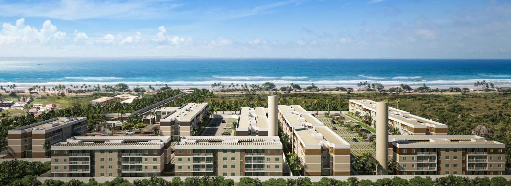 a rendering of an apartment complex near the beach at Apartamento térreo 100 mts da praia VOG in Ilhéus