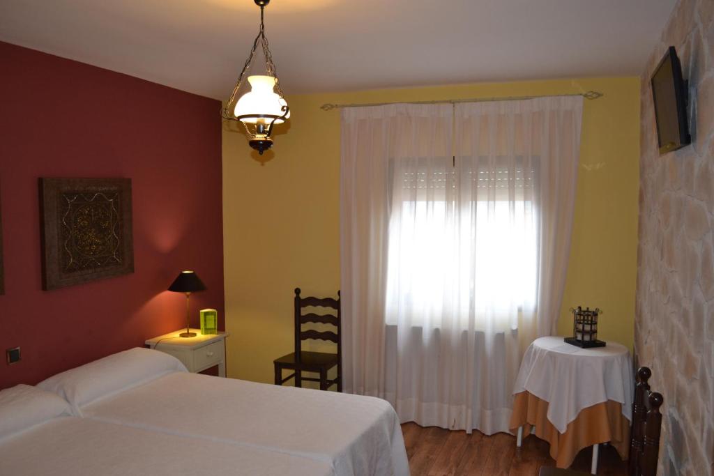 Postel nebo postele na pokoji v ubytování La Posada de Rosa