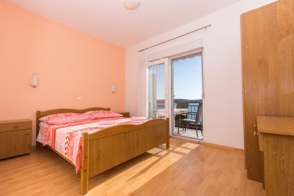 Posteľ alebo postele v izbe v ubytovaní Apartments Mastelić