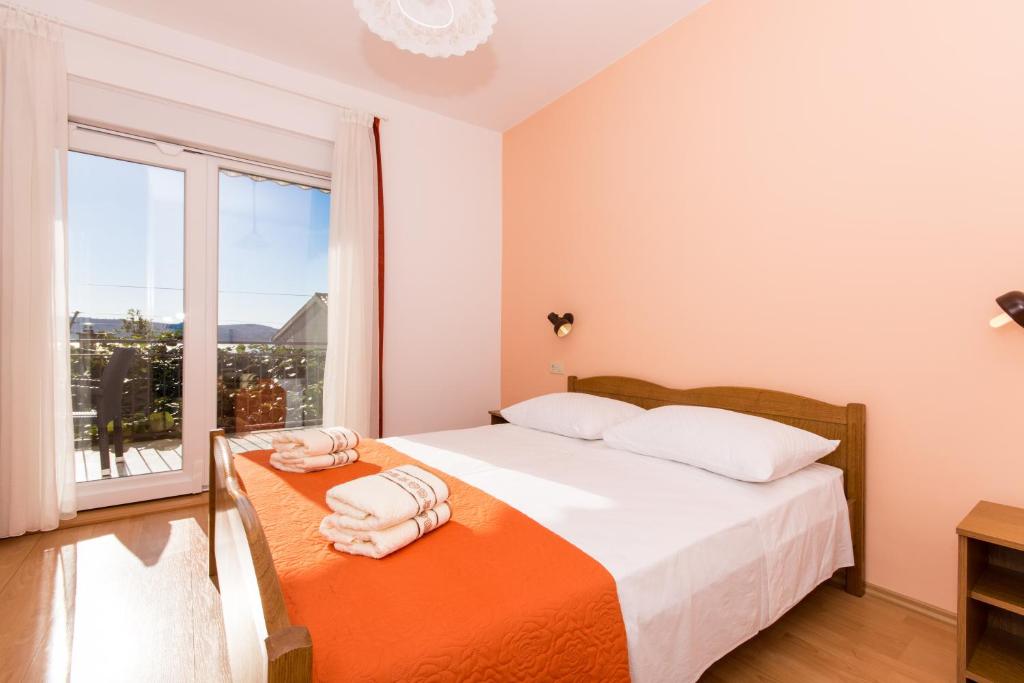 Posteľ alebo postele v izbe v ubytovaní Apartments Mastelić