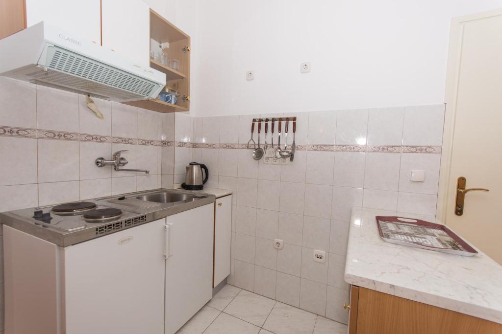 Kuchyňa alebo kuchynka v ubytovaní Apartments Mastelić