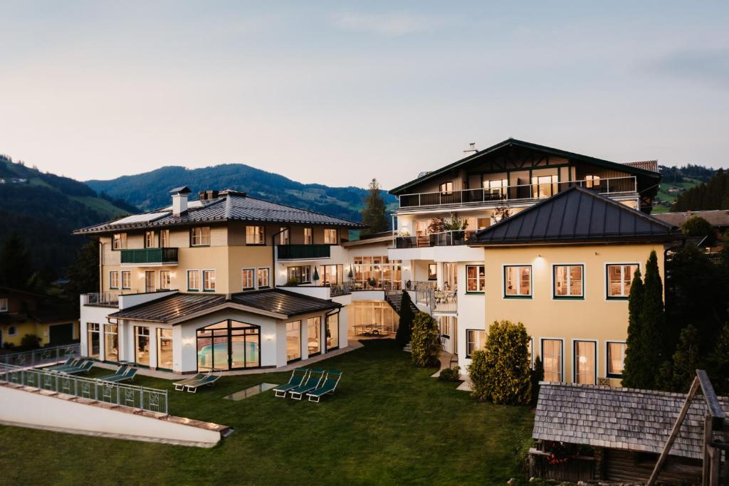 a large house with a yard in front of it at Alpina Wagrain in Wagrain