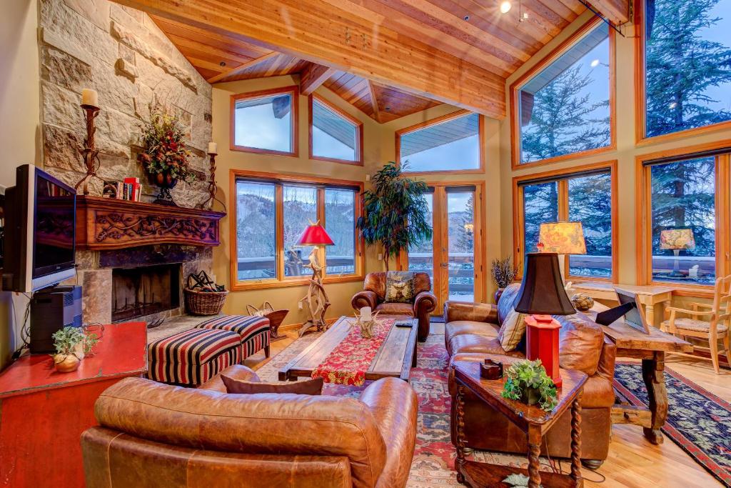 a living room filled with furniture and a fireplace at Twin Pines #2 in Park City