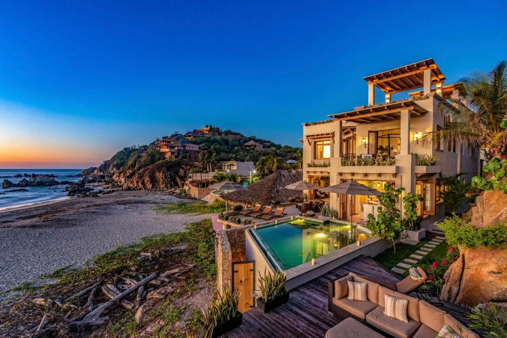 an aerial view of a house with a view of the beach at 1037 - Villa Escondida in Santa Cruz Huatulco