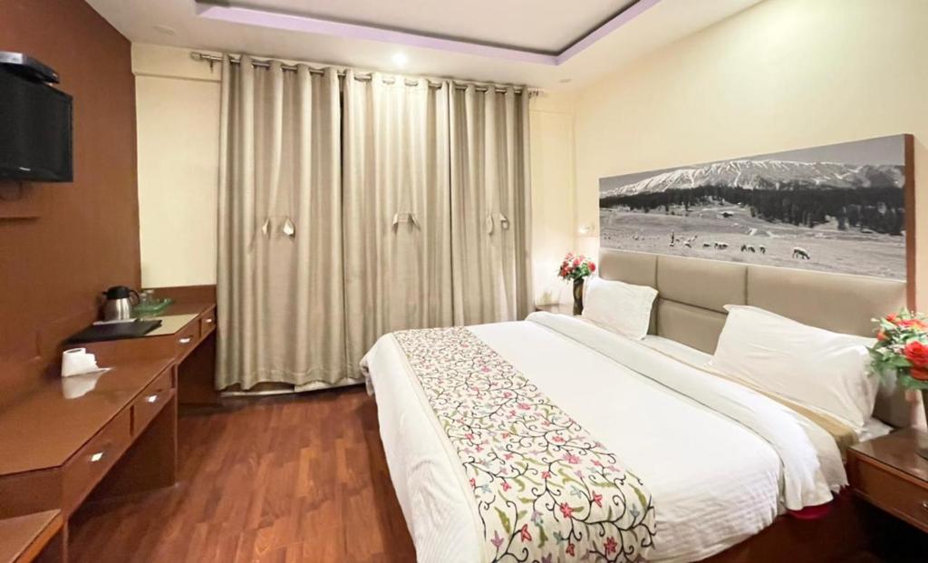 Postel nebo postele na pokoji v ubytování Hotel Centre Point